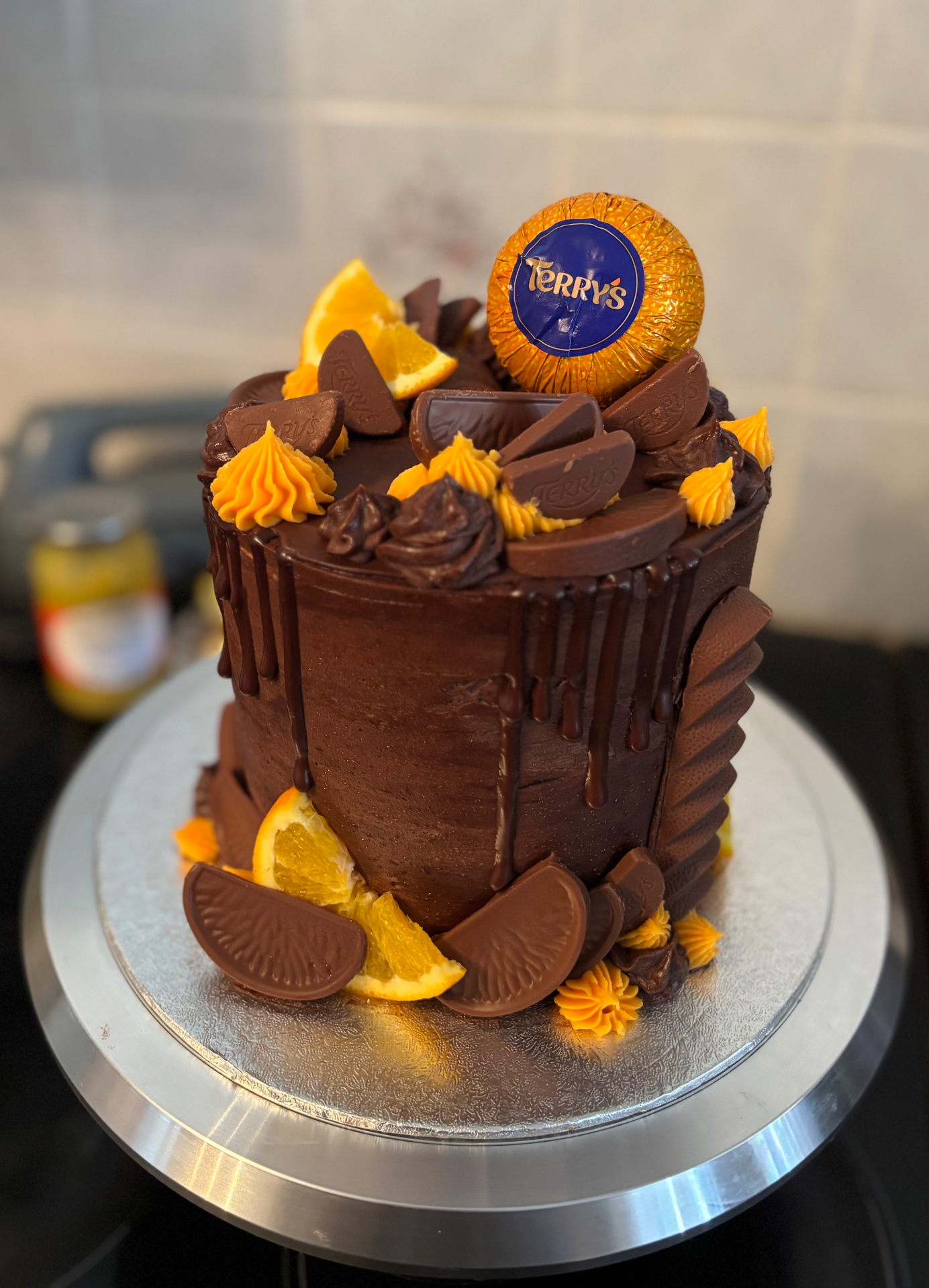 Terry's chocolate orange drip cake with orange slices and chocolate segments